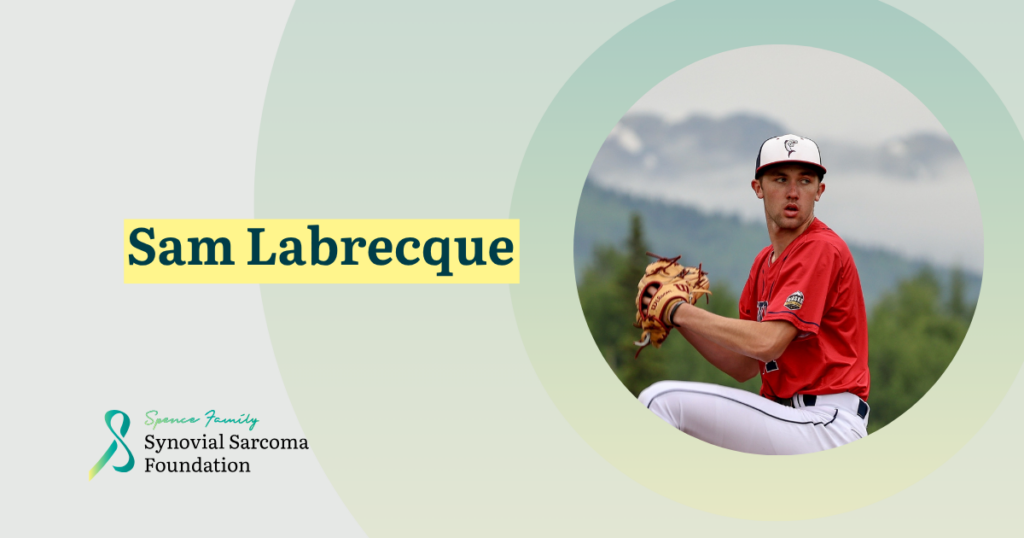 A baseball player in a red jersey and white pants prepares to pitch. "Sam Labrecque" is written in bold yellow text. The Synovial Sarcoma Foundation logo appears in the bottom left corner.
